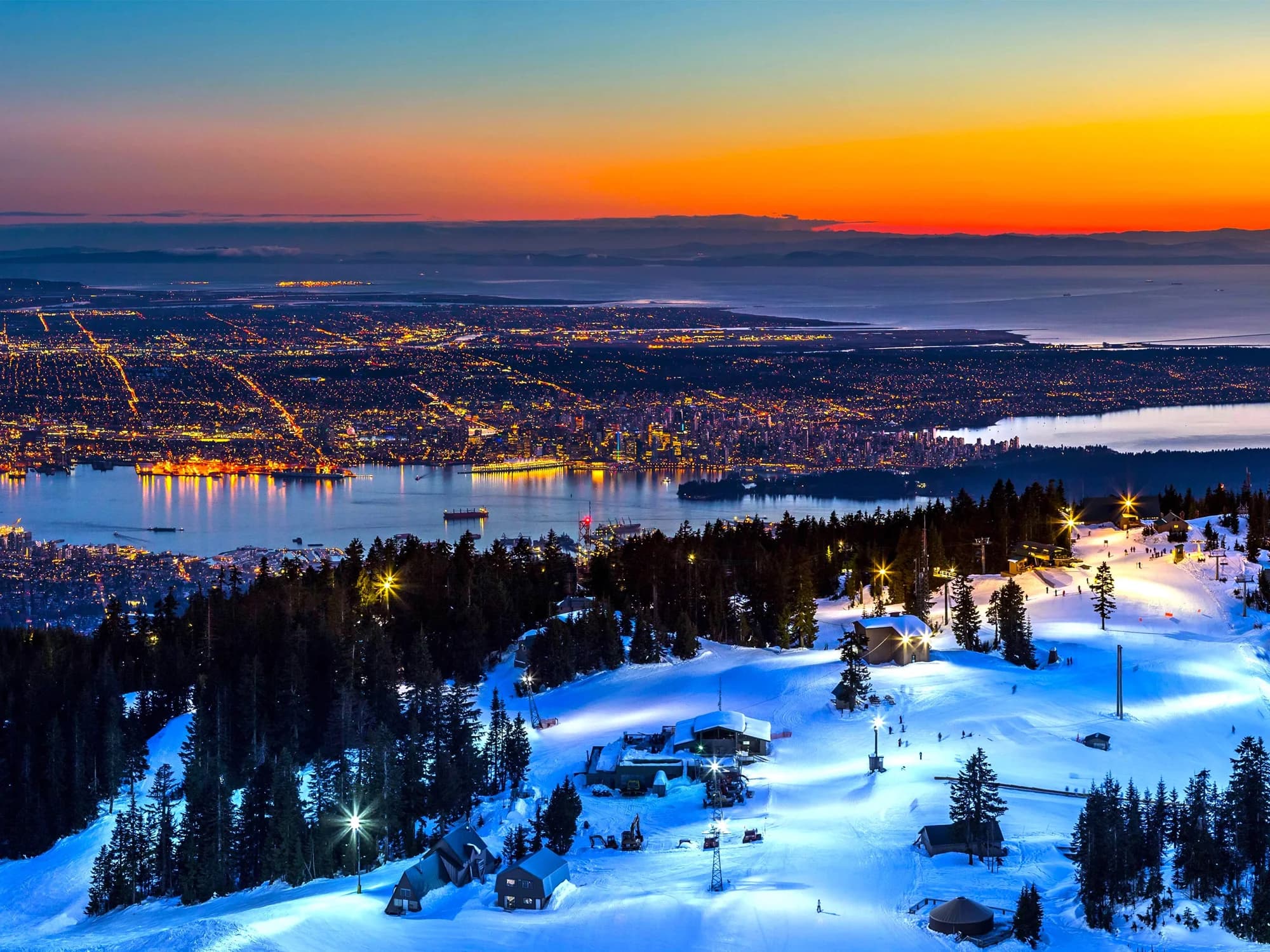 Vancouver · the city, water and mountains at dusk